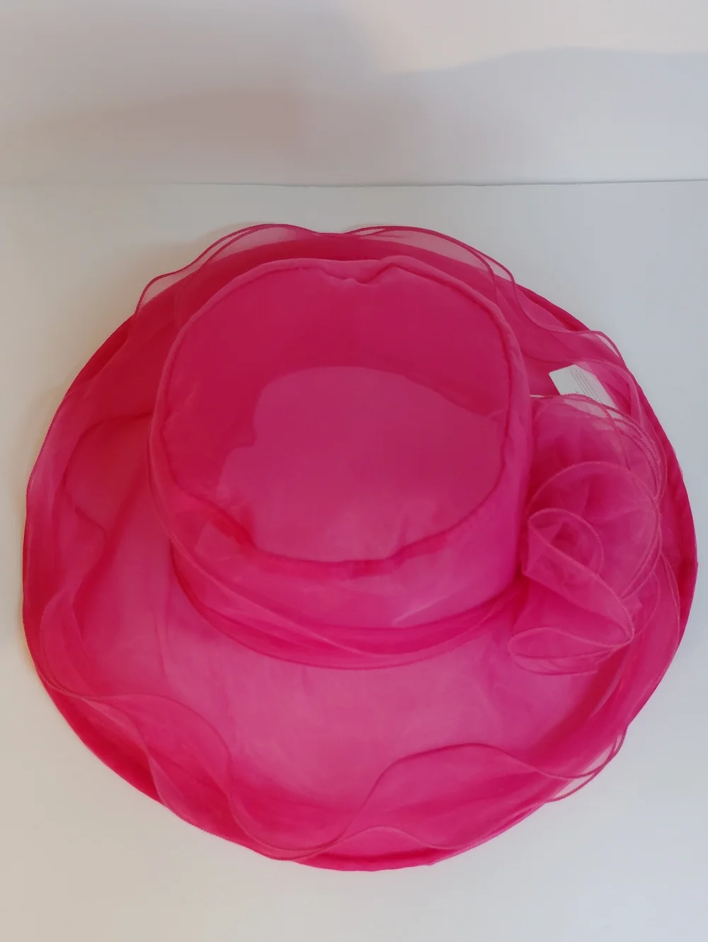 Elegant Hot Pink Organza Dress Hat with Floral Accent
